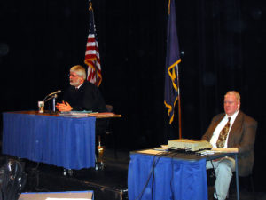 Judge MacKenzie holding court in a local school.